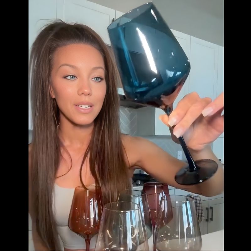 Customer holding Saludi blue glass